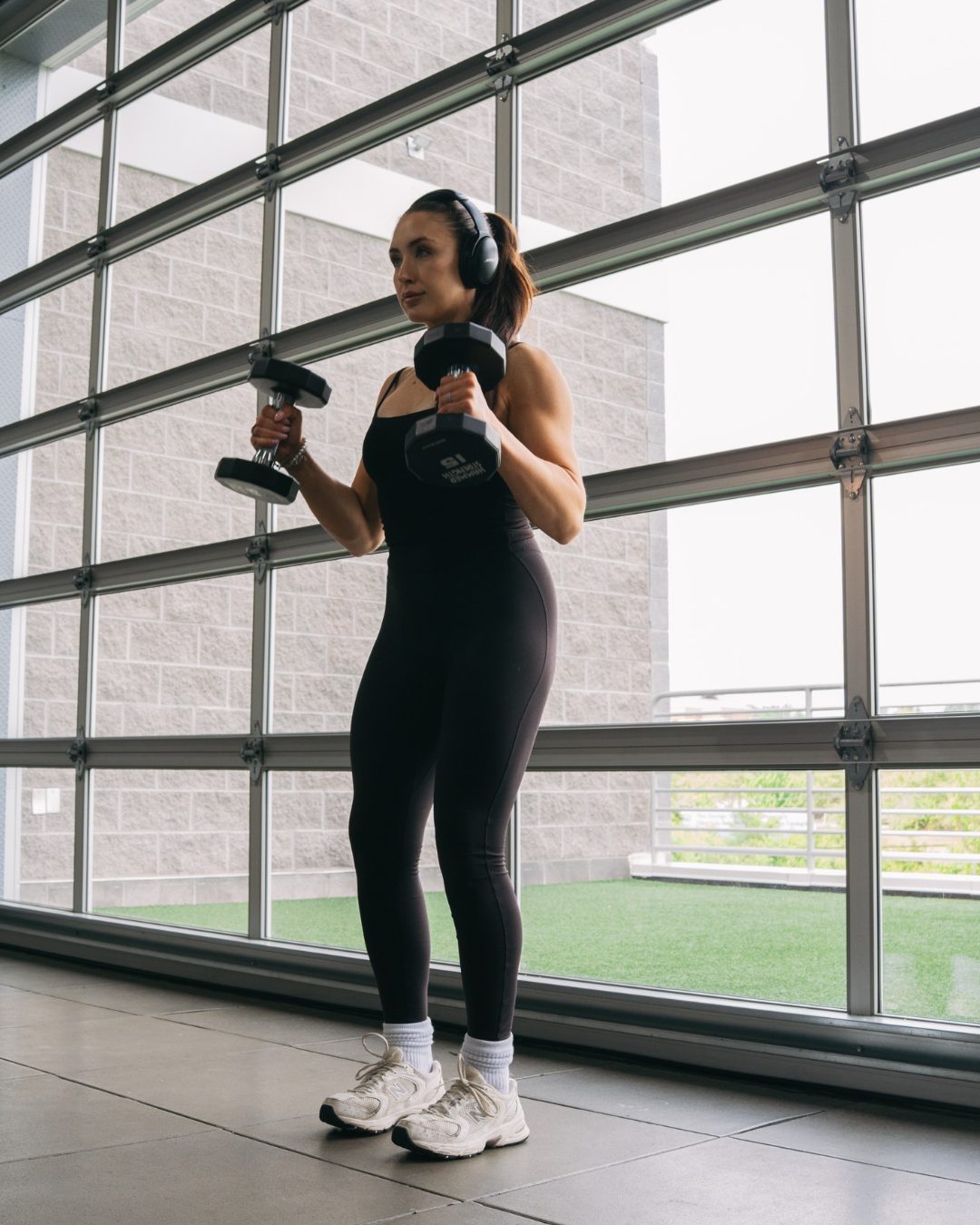 Brooke training with a pair of dumbbells